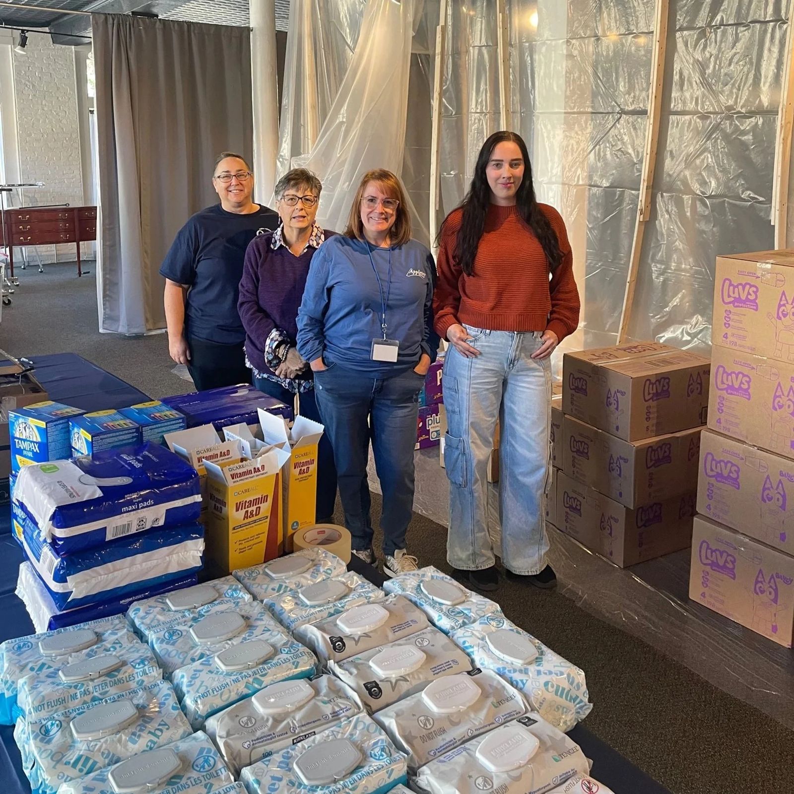 Volunteers with donated supplies
